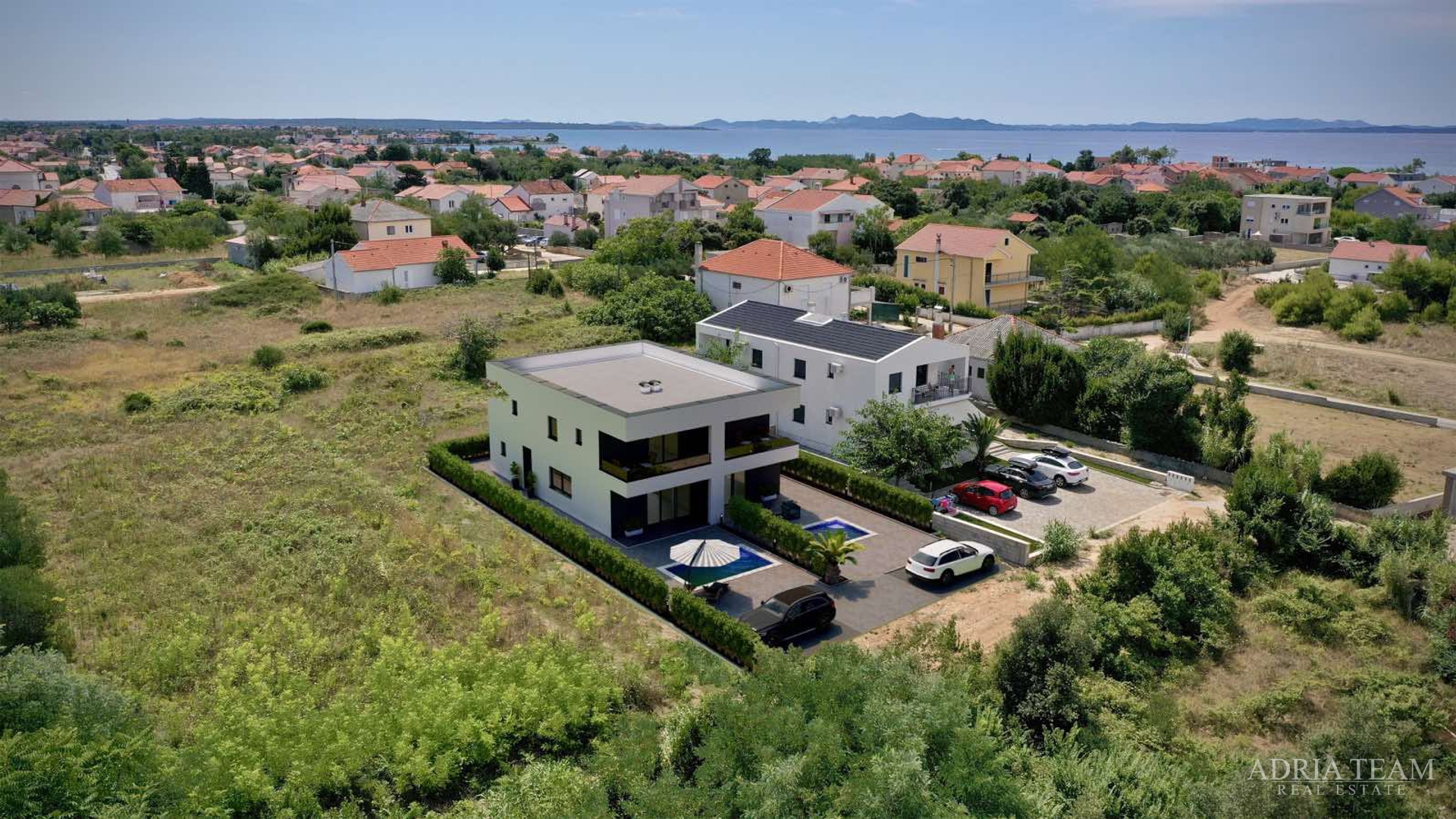Two halves of a house with a pool, newly built - Privlaka