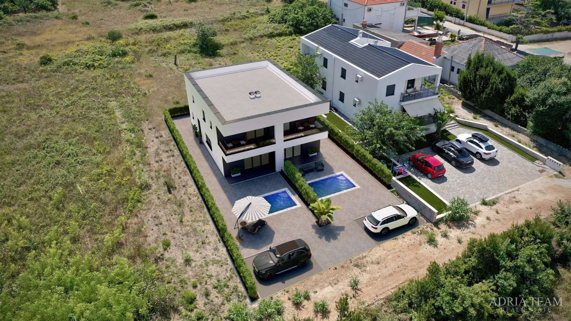 Two halves of a house with a pool, newly built - Privlaka