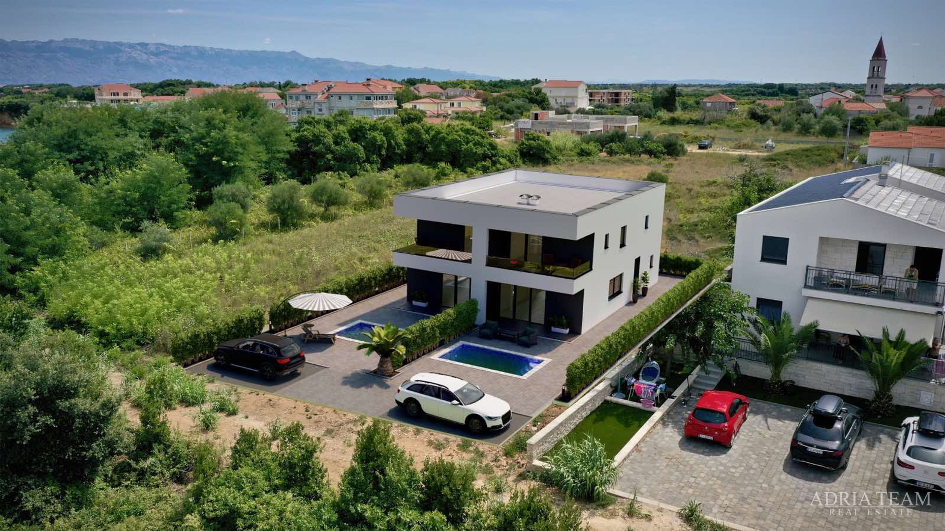 Two halves of a house with a pool, newly built - Privlaka