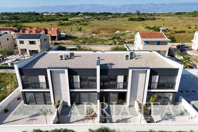 Two-storey apartments in new construction in two identical terraced houses - Privlaka
