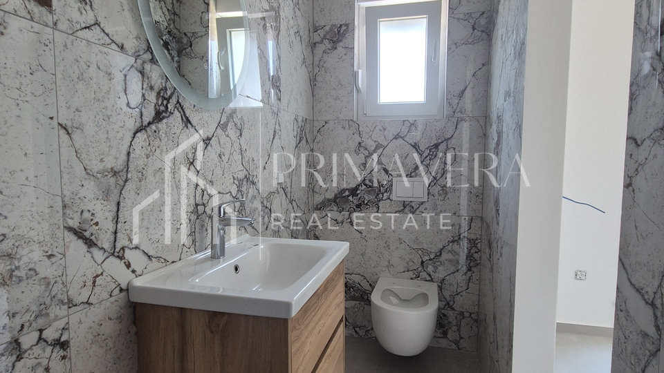 Suko&scaron;an&comma; new building&comma; a three bedroom penthouse with a roof terrace&comma; 100 m from the sea