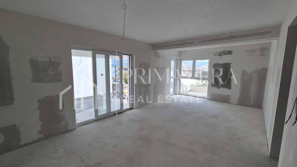 Ra&zcaron;anac&comma; modern two-bedroom apartment S3 in a new building with a view of the sea and Velebit