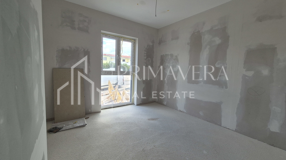 Ra&zcaron;anac&comma; modern two-bedroom apartment S3 in a new building with a view of the sea and Velebit