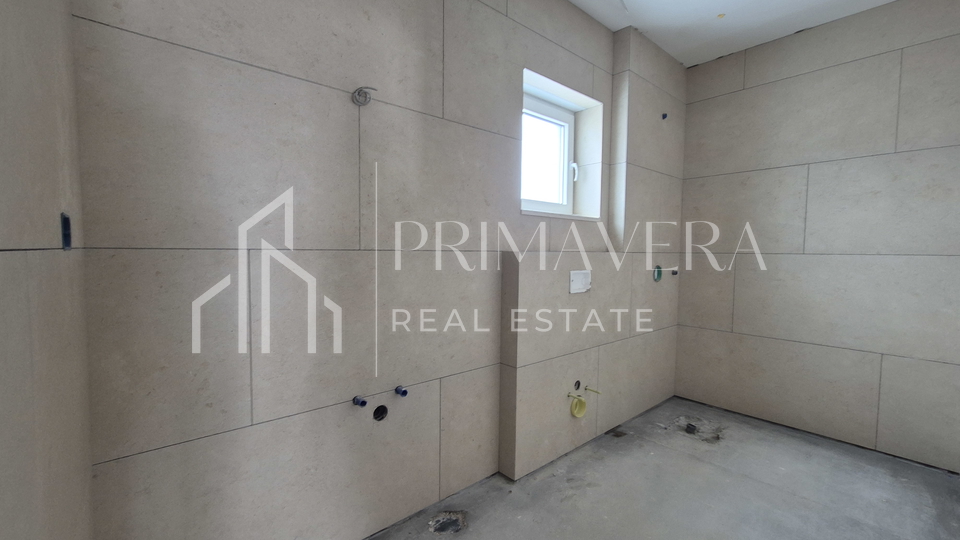 Ra&zcaron;anac&comma; modern two-bedroom apartment S3 in a new building with a view of the sea and Velebit