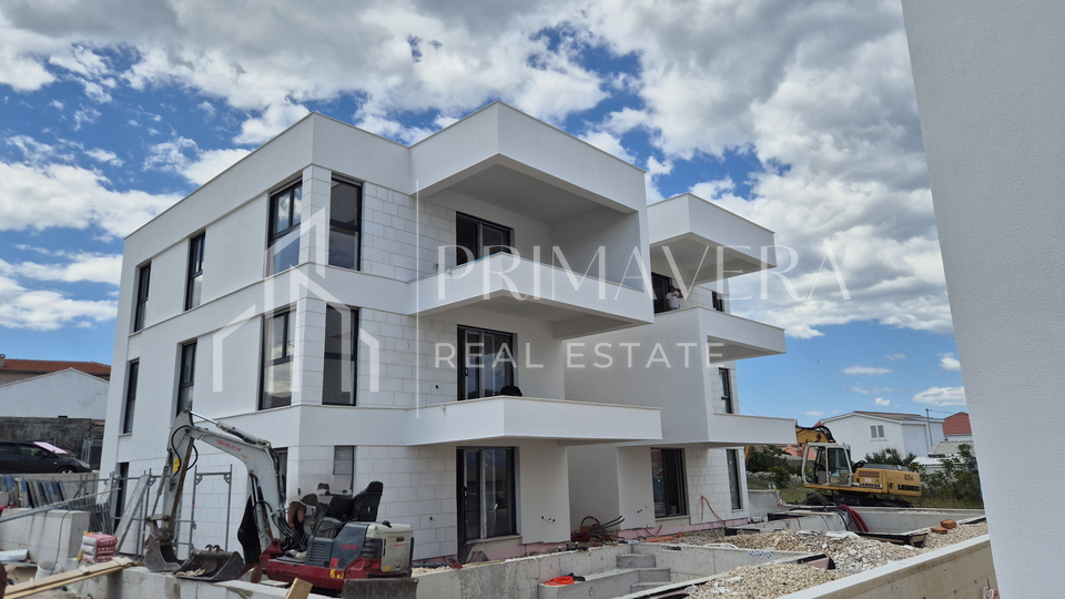 Ra&zcaron;anac&comma; modern two-bedroom apartment S3 in a new building with a view of the sea and Velebit