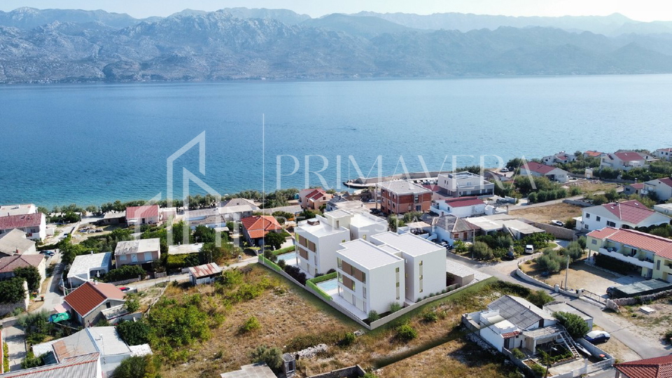 Ra&zcaron;anac&comma; modern two-bedroom apartment S3 in a new building with a view of the sea and Velebit