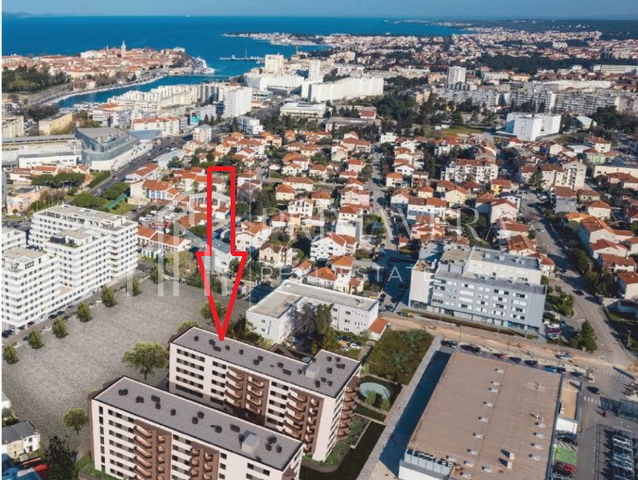 Stan/poslovni prostor za najam+ dva garažna mjesta, stambeni kompleks Portada