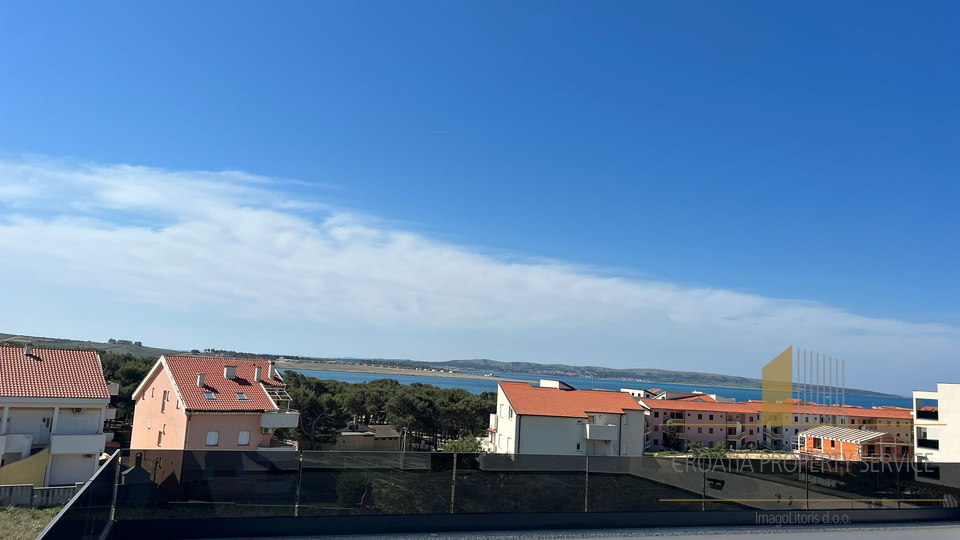 Apartment in a new building with a roof terrace and a view of the sea on the island of Pag!