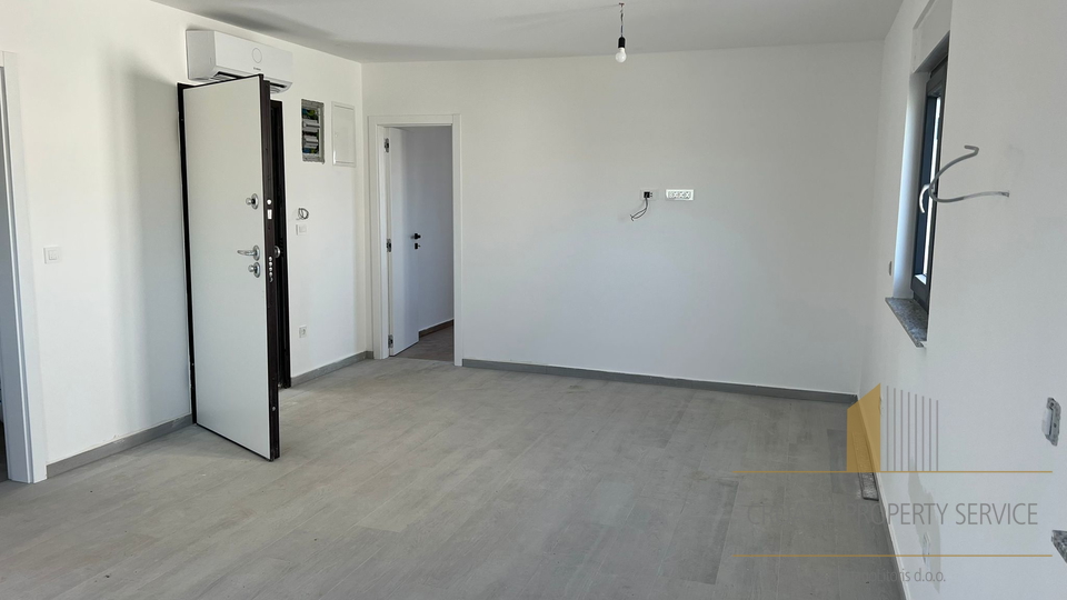 Apartment in a new building with a roof terrace and a view of the sea on the island of Pag!