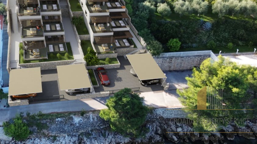 Luxury apartment with a garden in a new building, first row by the beach in the vicinity of Šibenik!