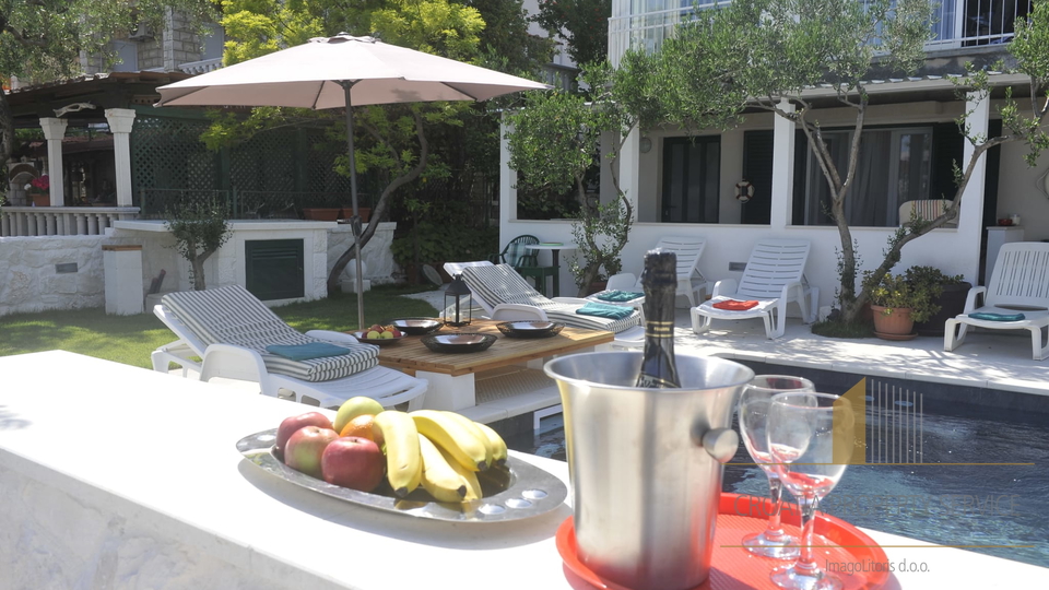 Exclusive sale! A beautiful villa with a pool, first row to the beach in Seget Donji!