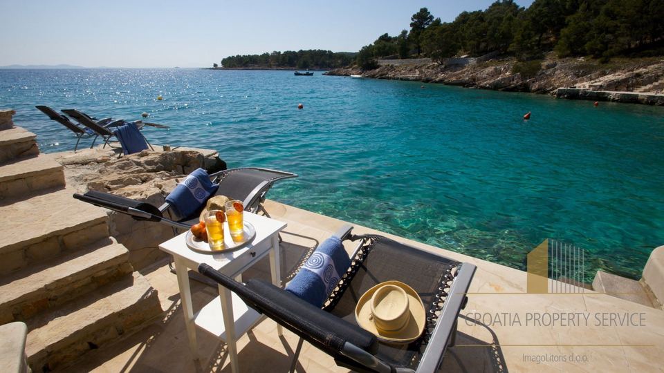 A luxury villa with a pool and a boat dock, first row to the sea on the island of Brač!