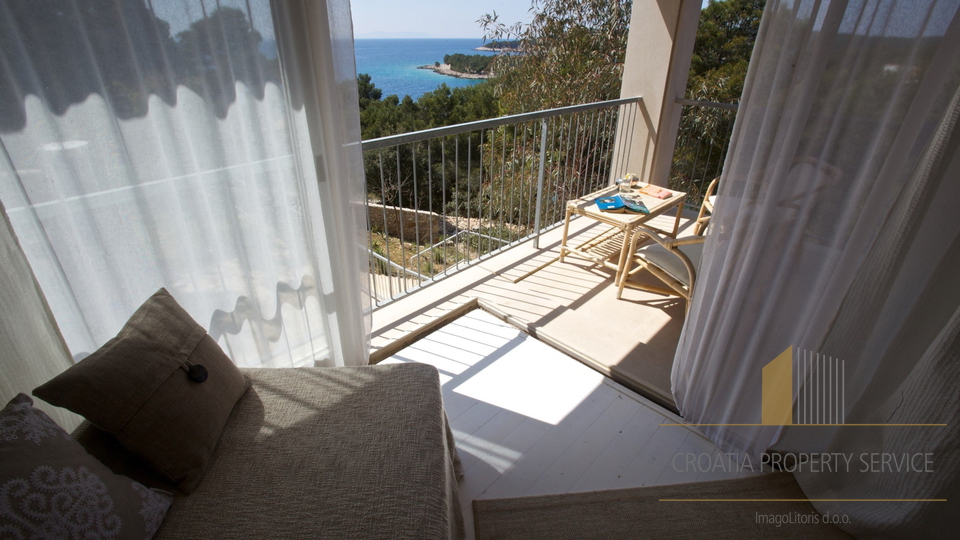 A luxury villa with a pool and a boat dock, first row to the sea on the island of Brač!