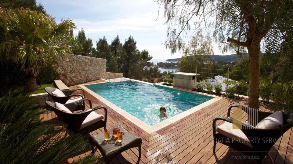 A luxury villa with a pool and a boat dock, first row to the sea on the island of Brač!