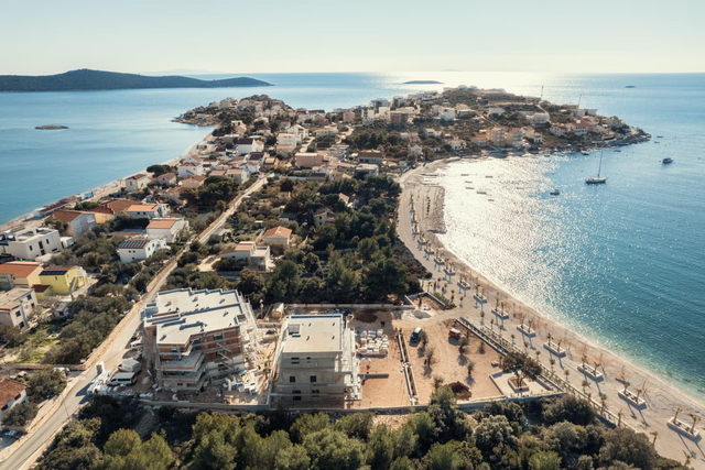 Luxury apartment with garden in a new building, first row to the sea near Trogir!