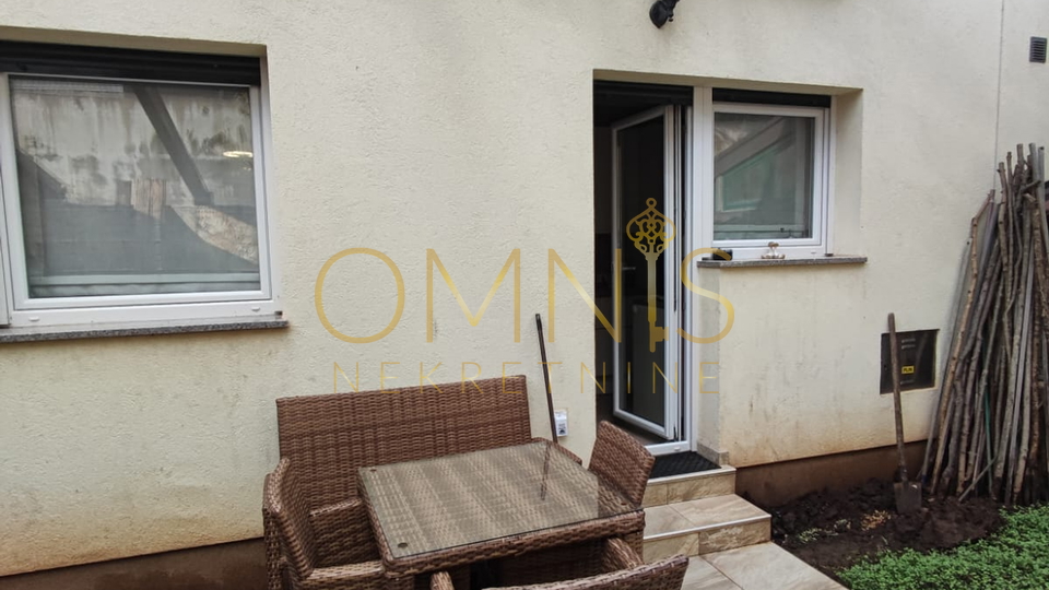 KOSTRENA – SPACIOUS TWO-LEVEL APARTMENT WITH YARD AND PARKING