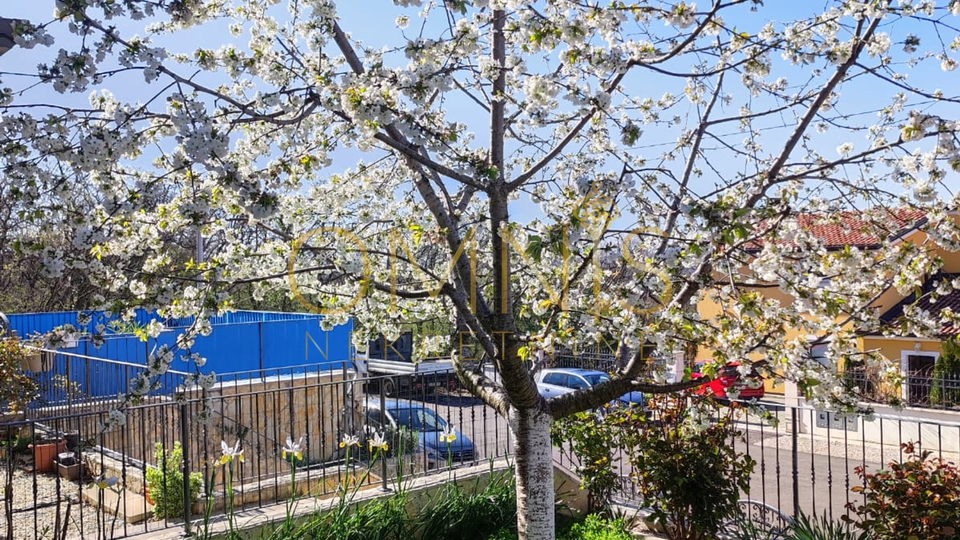 KOSTRENA – SPACIOUS TWO-LEVEL APARTMENT WITH YARD AND PARKING