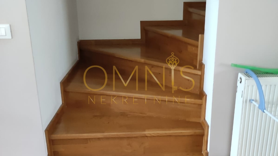 KOSTRENA – SPACIOUS TWO-LEVEL APARTMENT WITH YARD AND PARKING