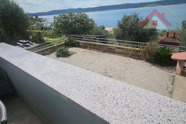 A detached house for sale, first row to the sea and the beach, with three apartments and a view of the sea, in the village of Sv. Petar na Moru, Zadar County