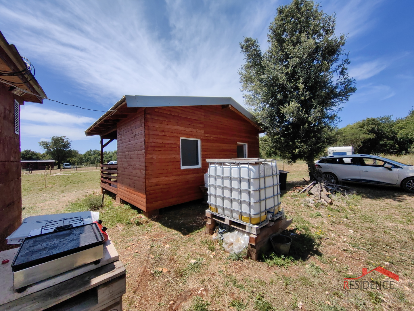 Agricultural land in Šišan with a weekend house