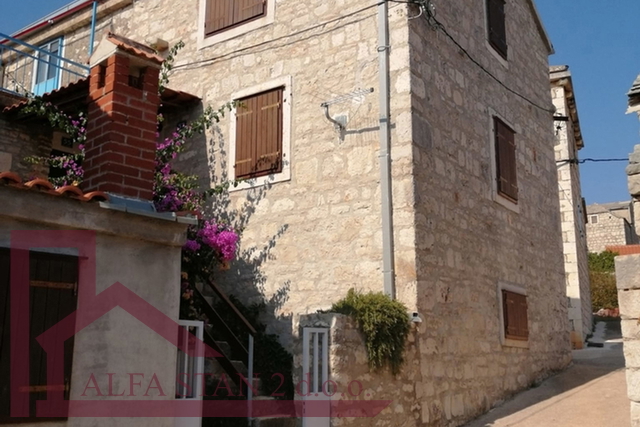 Renovated stone house with two bedrooms and a yard