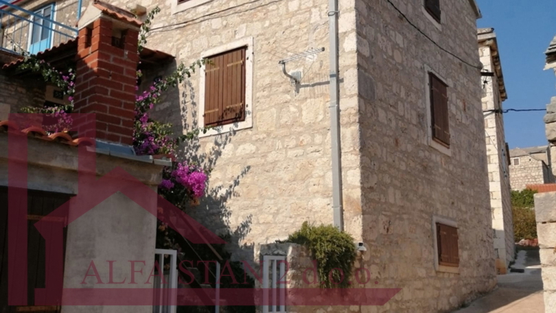 Renovated stone house with two bedrooms and a yard
