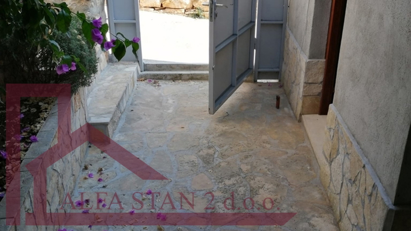 Renovated stone house with two bedrooms and a yard