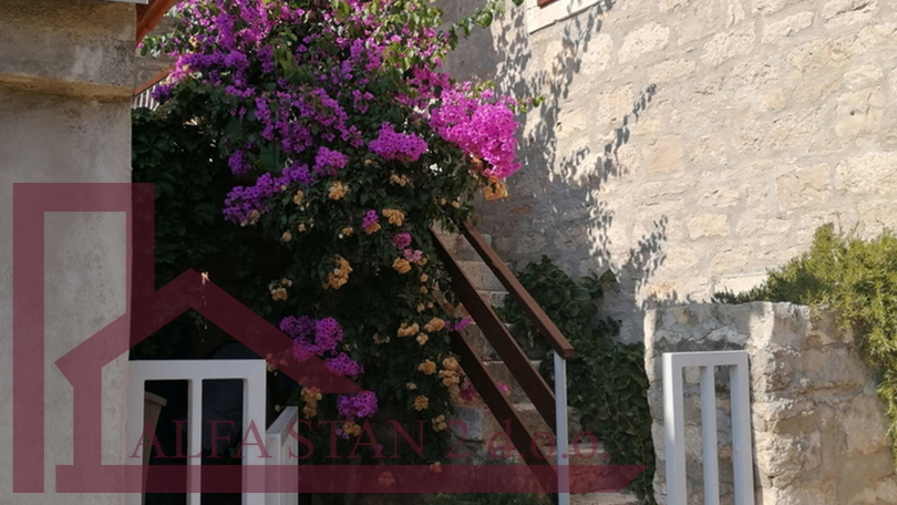 Renovated stone house with two bedrooms and a yard