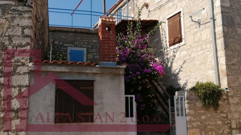 Renovated stone house with two bedrooms and a yard