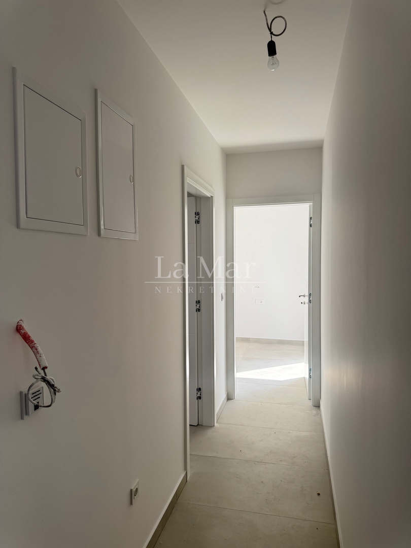 EKSKLUZIVNO! Novogradnja u Novalji s pogledom na more -Z2 - A2- 66,79 m2 - I kat