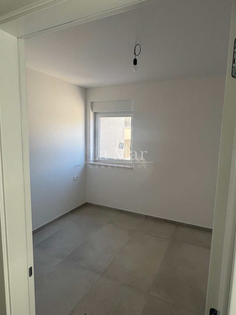 EKSKLUZIVNO! Novogradnja u Novalji s pogledom na more -Z2 - A2- 66,79 m2 - I kat