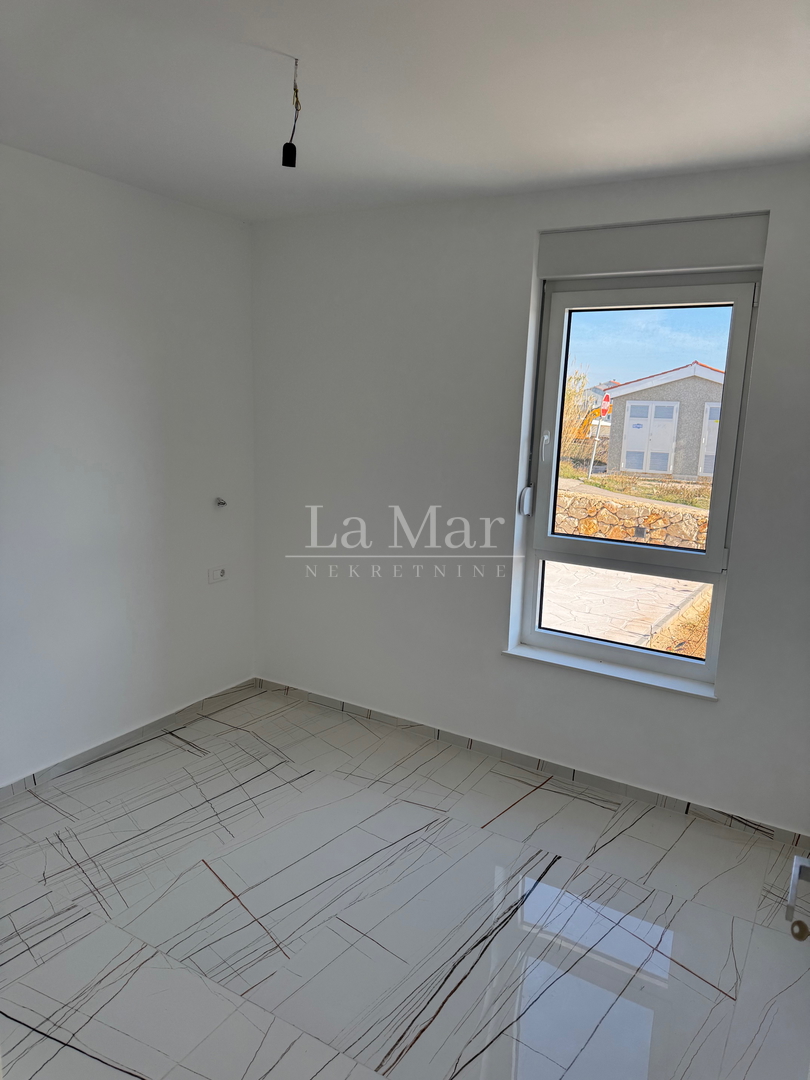 Novalja- namještena NOVOGRADNJA s pogledom na more - S1 - prizemlje  81,6 m2- 290.000€