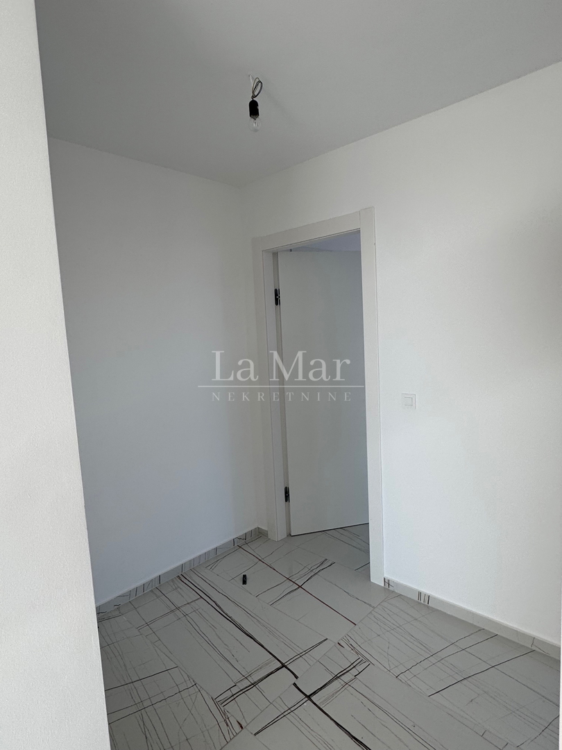 Novalja- namještena NOVOGRADNJA s pogledom na more - A2 - I. kat-  68,3 m2 - 260.000€