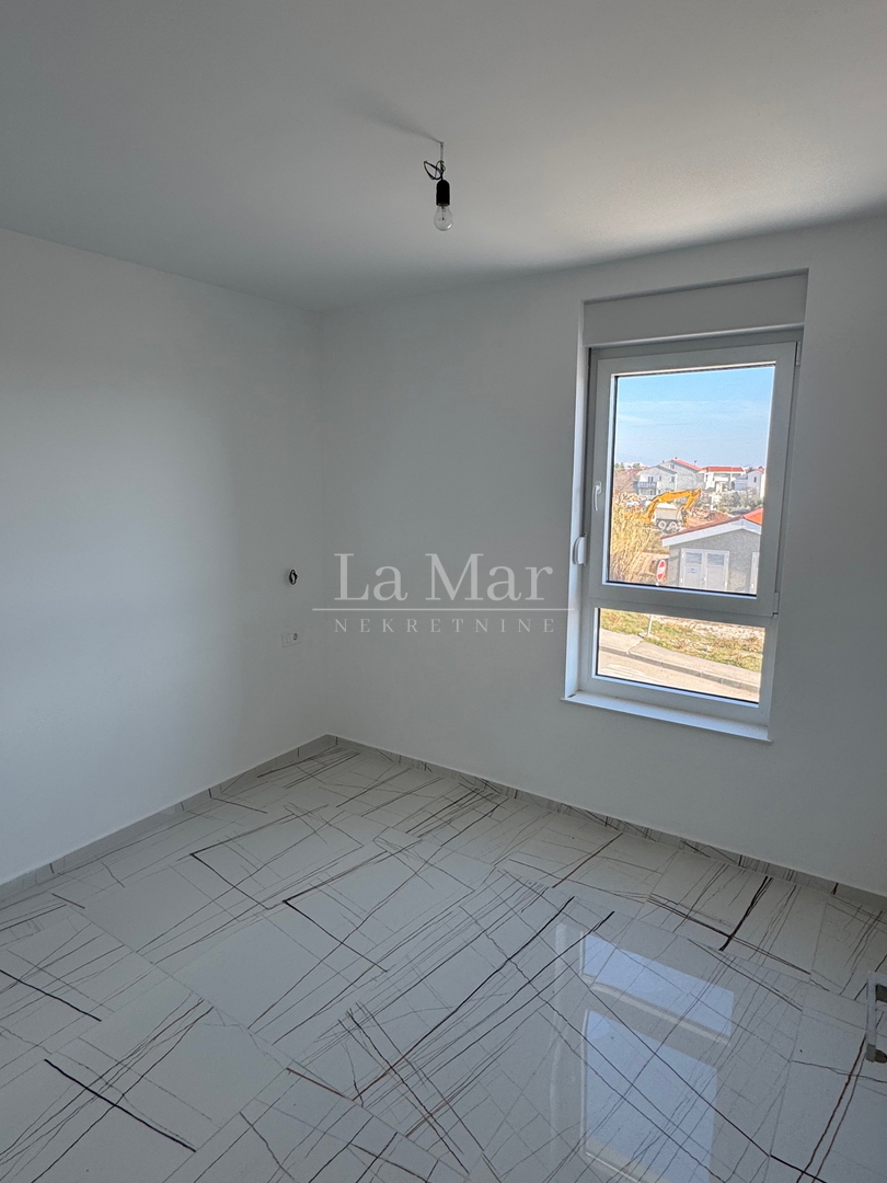 Novalja- namještena NOVOGRADNJA s pogledom na more - A2 - I. kat-  68,3 m2 - 260.000€