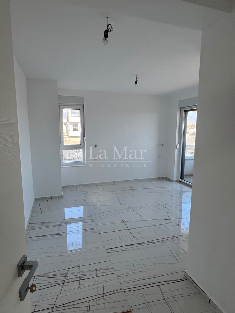 Novalja- namještena NOVOGRADNJA s pogledom na more - A2 - I. kat-  68,3 m2 - 260.000€